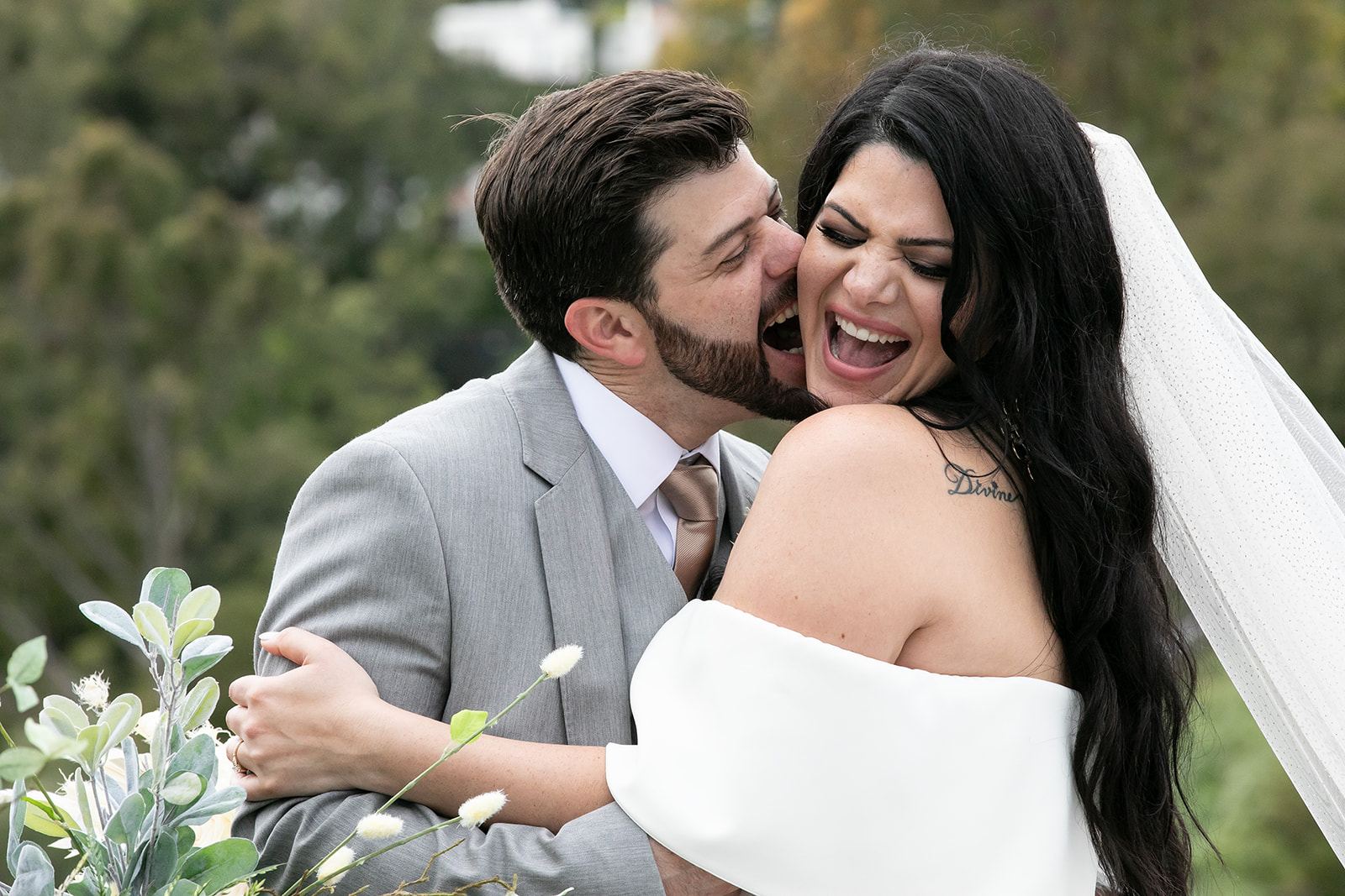 Cam and Sari laughing on their wedding day